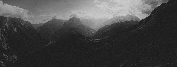 natural soundscape: dark mountains valley with clouds
